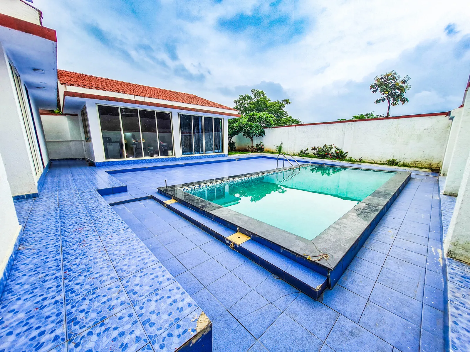 Pool deck and villa at Sihra Villa