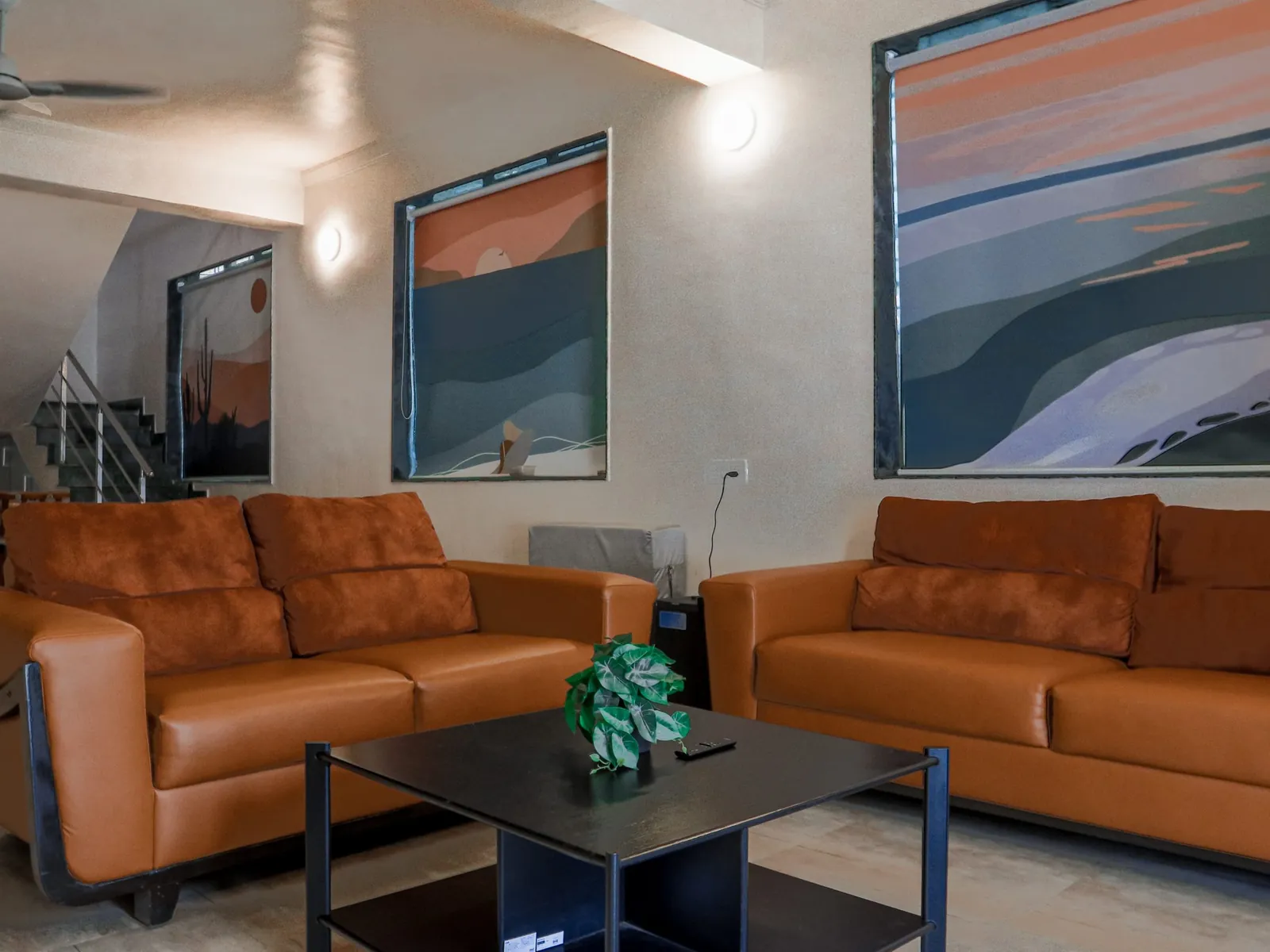 Living hall with leather sofas at Vandana Villa